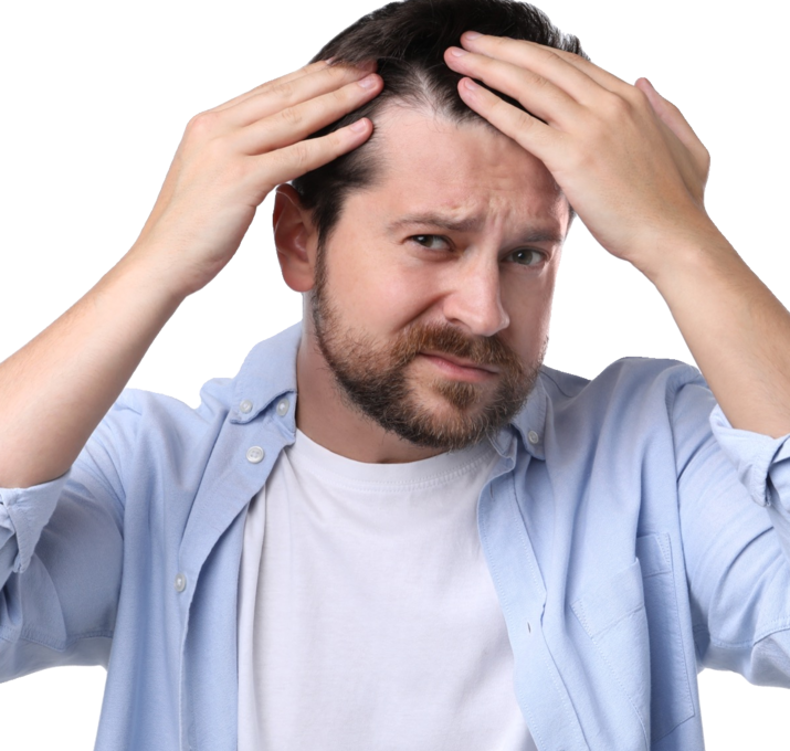 Man examining his thinning hairline
